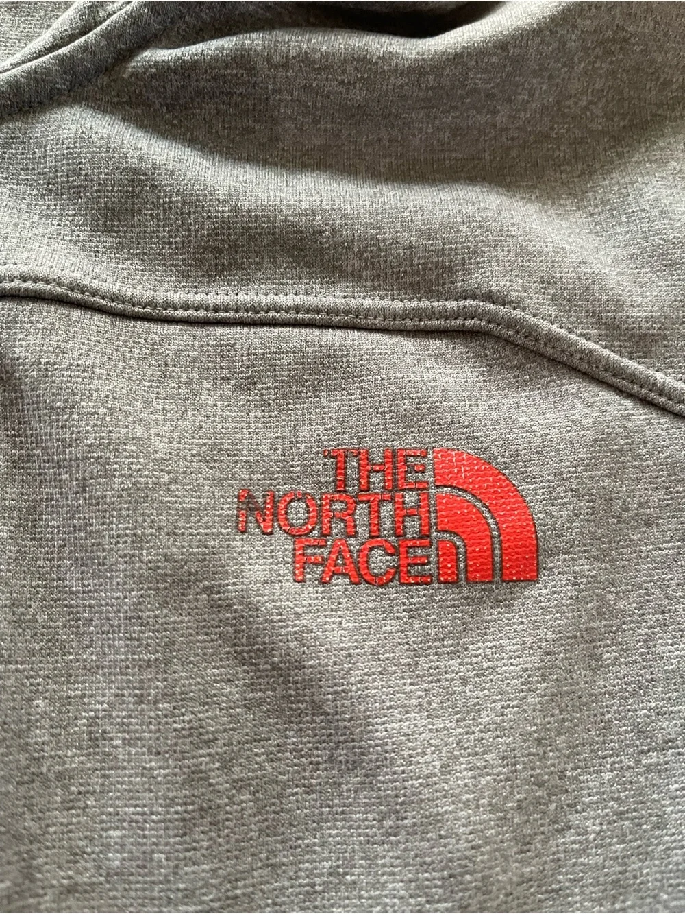 The North Face Men's Hooded Lightweight Jacket in Light Gray with Orange Accents